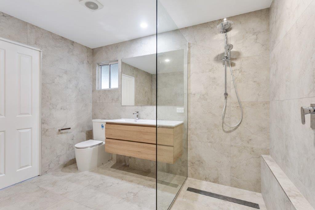 Frameless walk-in shower zone
